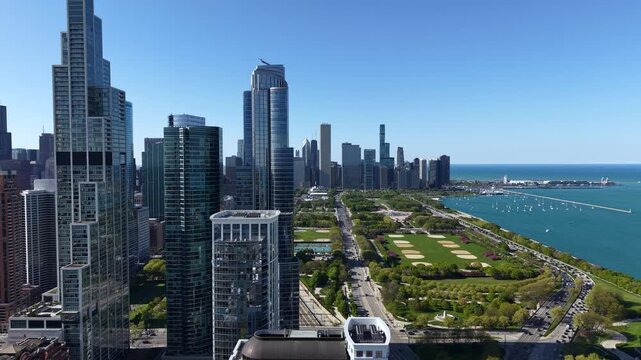 Chicago Cityscape Skyline, Revealing Drone Shot of Grant and Millennium Park by Lake Michigan From Condominium Complex