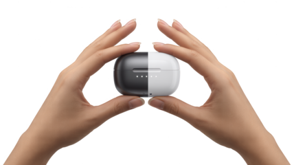 Hands holding a twotone black and white wireless earbud charging case isolated on transparent background