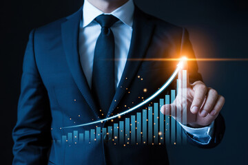 Businessman in a dark suit tapping a luminous arrow ascending over a bar chart, symbolizing significant business growth