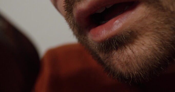 Close-up of a person speaking while recording a voice memo on their smartphone, illustrating communication, messaging, and modern digital interaction.