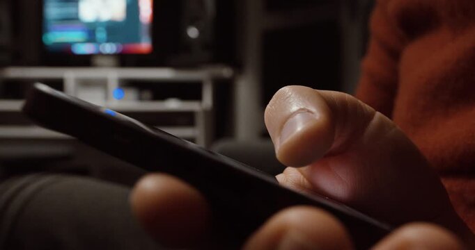 Close-up shot of a finger swiping upward on a smartphone screen, representing scrolling through short-form content like Reels or TikTok videos.