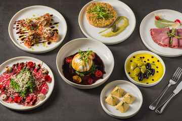 Colorful Mediterranean starters with olives, cheese, and vibrant sauces