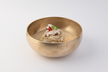 Creamy Mushroom Pasta with Garnish in Traditional Brass Bowl