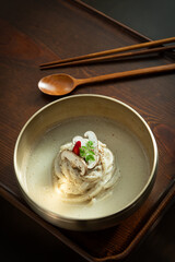 Traditional Korean Cold Noodles in Brass Bowl