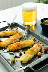 Delicious Fried Cheese Sticks with Sausages, Beer, and Salad