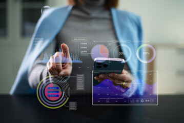 Closeup of smartphone user planning with a futuristic dashboard UI, featuring data visualization, calendar interface © Nikon
