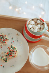 Christmas holiday cookies with hot chocolate and milk