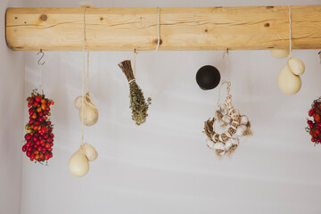 Herbs, tomatoes, cheese and garlic hang to dry