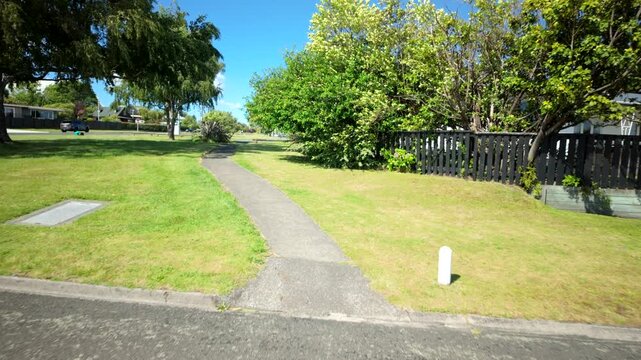 Suburban Footpath Between Lawns And Houses