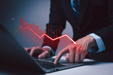 Man using laptop. Global business crisis and recession trend. Recession is the concept of economic downturn in financial stocks or stock market.