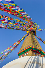 Colorful prayer flags on to the Boudhanath stupa in Kathmandu, Nepal