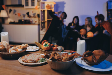 Friends enjoying a Halloween party at a bar making a toast