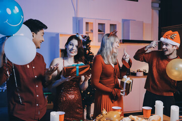 Festive Office Christmas Party with Delicious Food. A beautifully decorated office space with Christmas trees and festive lights, set up for a holiday party.