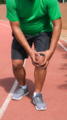 Fototapeta premium Young adult male with muscle pain during running. runner have knee ache due to Runners Knee or Patellofemoral Pain Syndrome