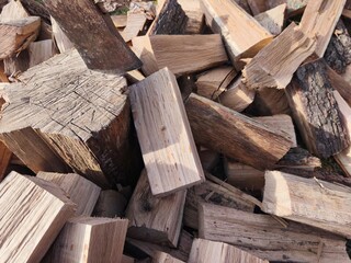 Chopped Firewood and Axe in Sunlight
