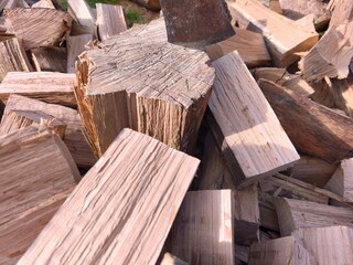 Chopped Firewood and Axe in Sunlight