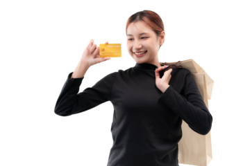 Happy young woman holding credit card and shopping bags on transparent background.