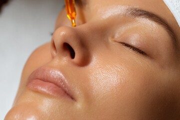 Glowing skin treatment featuring serum application enhances hydr