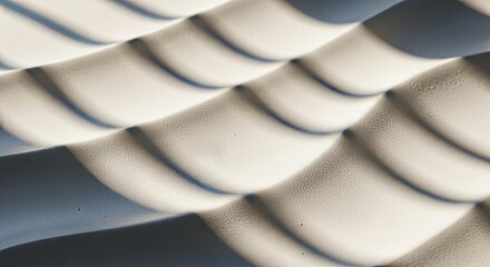 Soft, undulating waves of light and shadow create a calming abstract pattern