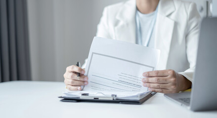 Business woman employer holding resume hiring recruit looking cv resume to hire candidates, analyzing information before job interview. Recruitment concepts