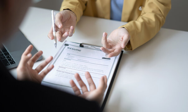 Business people hold a resume and talk to job applicants for job interviews about careers and Their personal history in the company. Recruitment concepts
