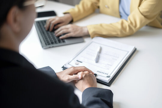 Business people hold a resume and talk to job applicants for job interviews about careers and Their personal history in the company. Recruitment concepts