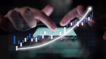 Close-up view of hands interacting with a smartphone displaying stock market trends and financial graphs, showcasing the significance of technology in investment strategies. Copula - Powered by Adobe