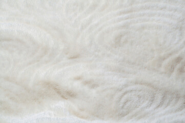 Soft white fur texture with swirling patterns, perfect for backgrounds