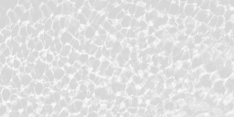 Bright sun glare on rippling, clear water over  light gray tiled surface, creating sparkling, wavy caustic pattern