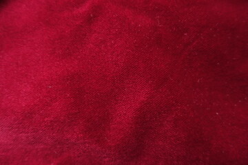 Dark red velour cotton fabric from above