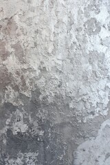 Fototapeta premium Textured grey and white plaster with peeling paint and rough surface background