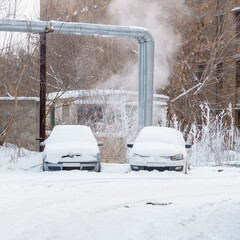 Cars covered with snow in Parking lot