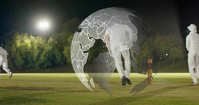 Bowler running releasing on lit cricket pitch, batsman running to score as globe covering stumps