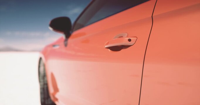 A vibrant orange car stands out against a vast white snow covered landscape under a clear blue sky. The sleek design gleams in the sunlight, showcasing its modern features.