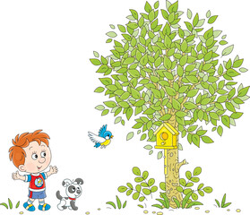 Happy little boy with his puppy watching a small bird flying around a wooden homemade birdhouse in a green park, vector cartoon illustration on a white background
