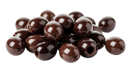 Pile of glossy dark brown pitted olives with visible starshaped incisions against a stark for food design