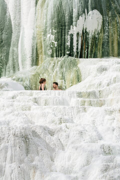 couple relaxing in natural hot springs