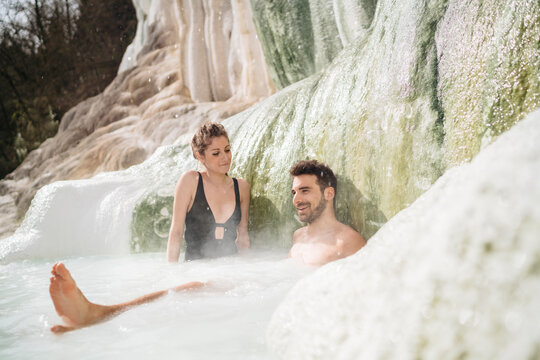couple relaxing in natural hot springs
