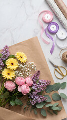 Floral bouquet with daisies, roses, lilacs, and eucalyptus lies on marble with ribbons, paper rolls, twine, and scissors. A creative setup for spring gift wrapping, floral design, or DIY content.