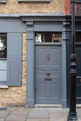 Traditional grey front door of historic london townhouse