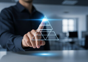 Businessman touching a glowing pyramid chart representing business growth and success on a digital interface