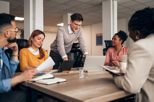 Team Collaboration During a Business Meeting in a Modern Office Setting