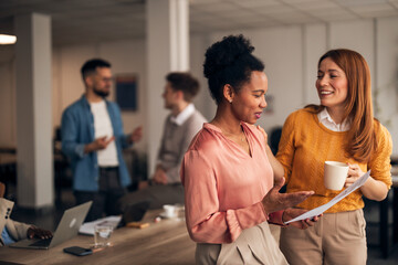 Colleagues Collaborating in a Professional Office Setting with Positive Interaction