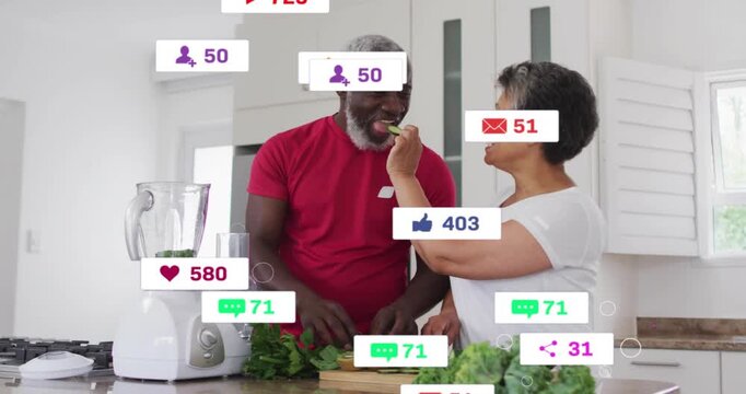 Couple cooking at counter, man slicing kiwis woman offering bite, icons popping over couple, fading