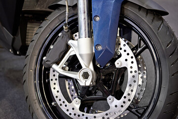 Wheel of modern black motorcycle