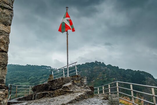 Ikurrina Basque Flag Waving Over San Juan de Gaztelugatxe, Spain
