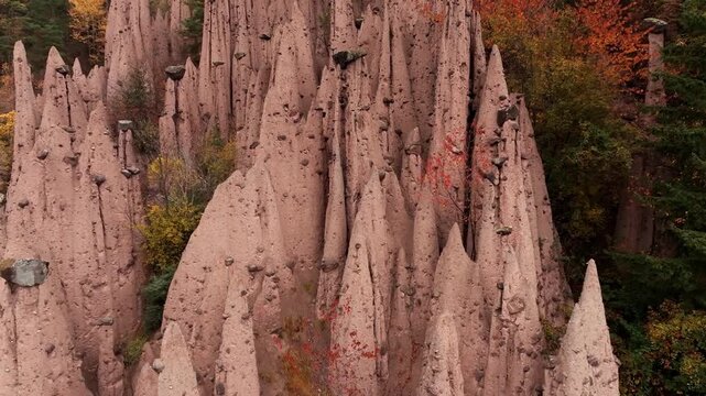 Earth pyramids of Platten at daytime, aerial view, at autumn season time.