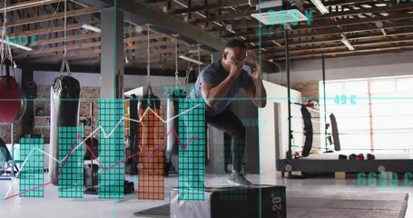Male trainee taking approach launching plyo box jumps for fitness while HUD charts overlaying frame - Powered by Adobe