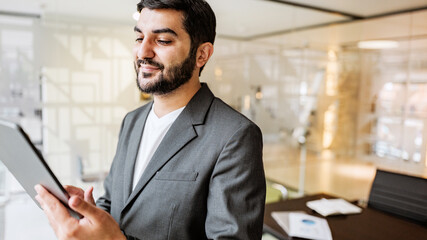 Man using tablet in modern office setting