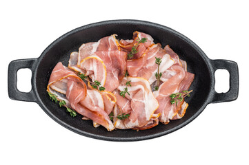 Uncooked pork bacon strips arranged with thyme in skillet great for kitchen cooking themes recipe blogs and gourmet food